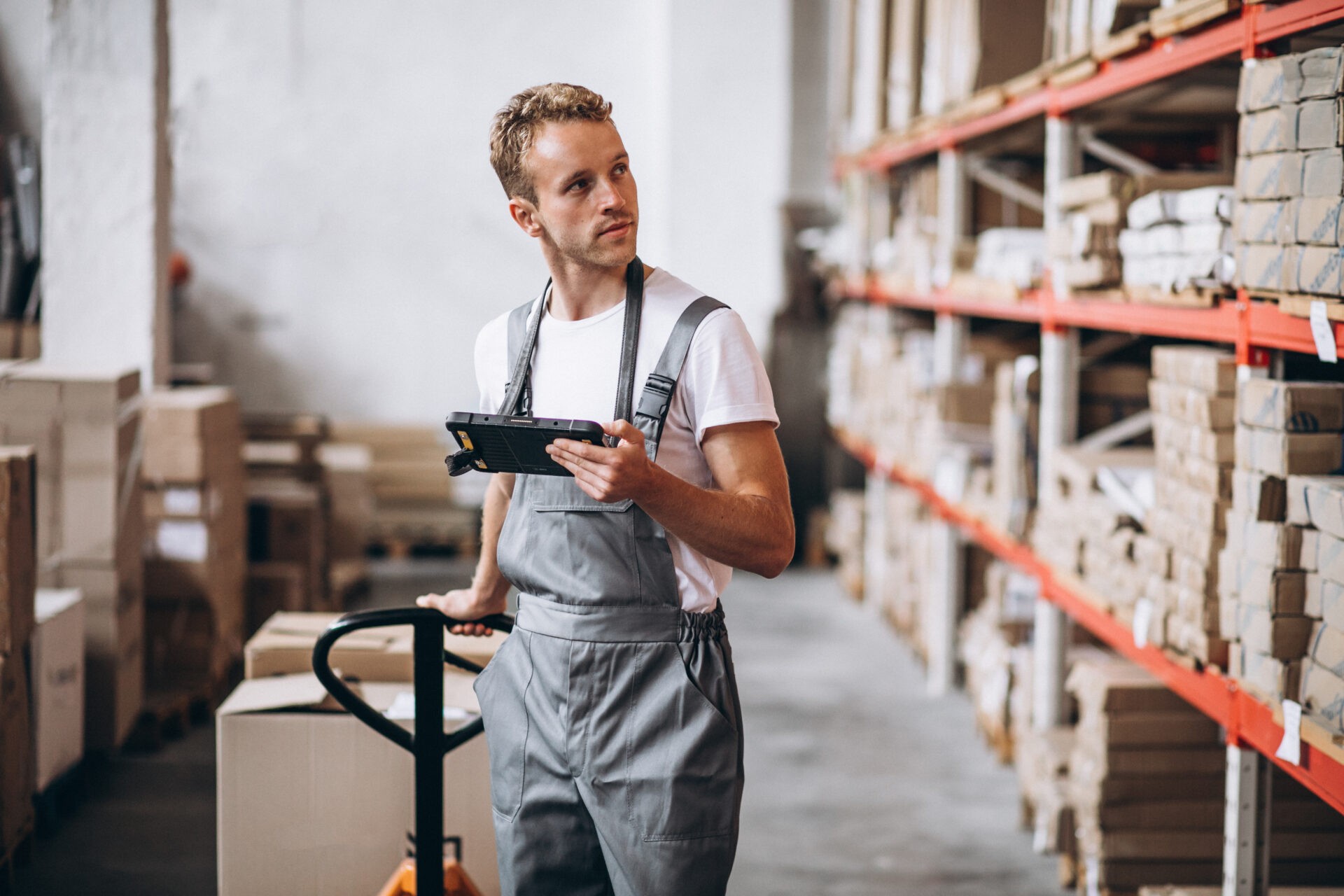 Warehouse worker organizing packages for international e-commerce delivery