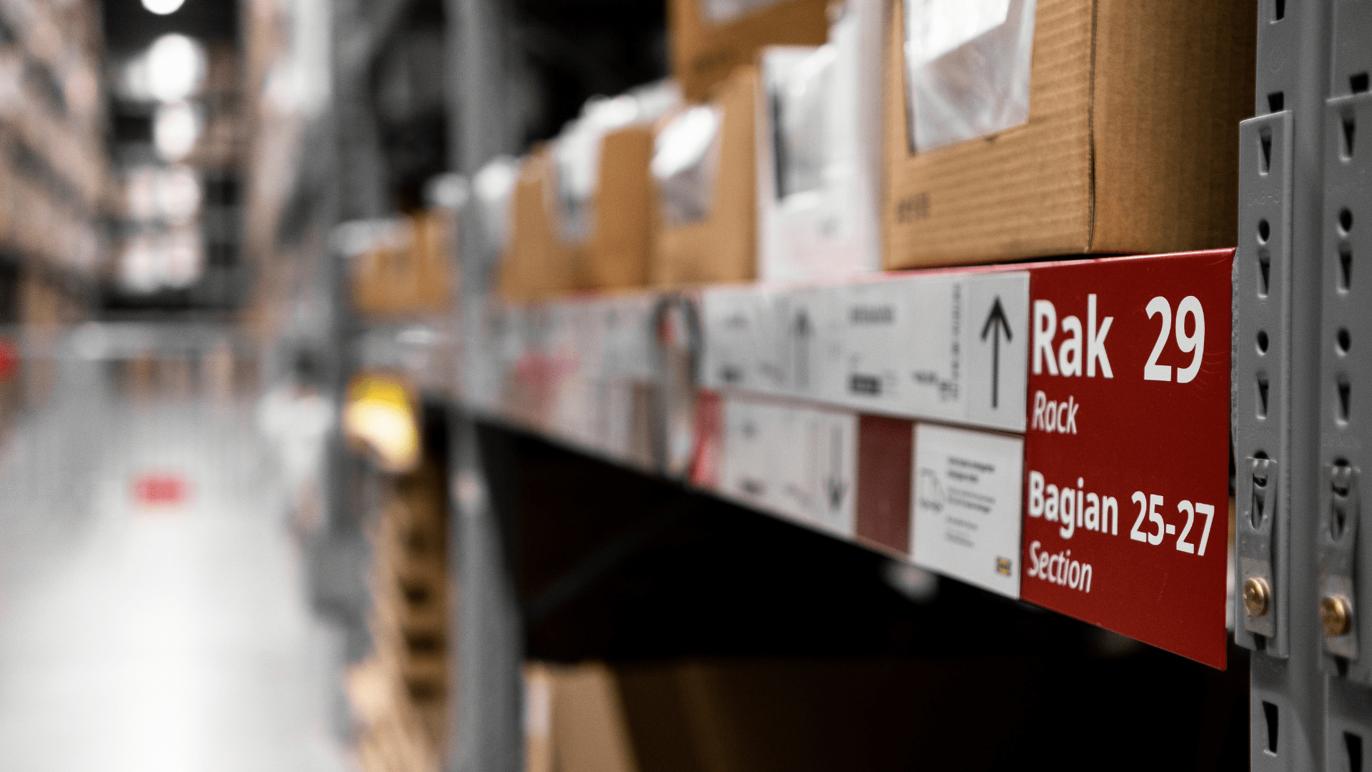 Close-up view of labeled warehouse shelving in a Central-Europe fulfillment center, illustrating organized storage infrastructure for efficient e-commerce logistics.