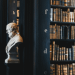 Historic European library interior with marble busts and shelves filled with old legal books, symbolizing tradition and knowledge of EU law.