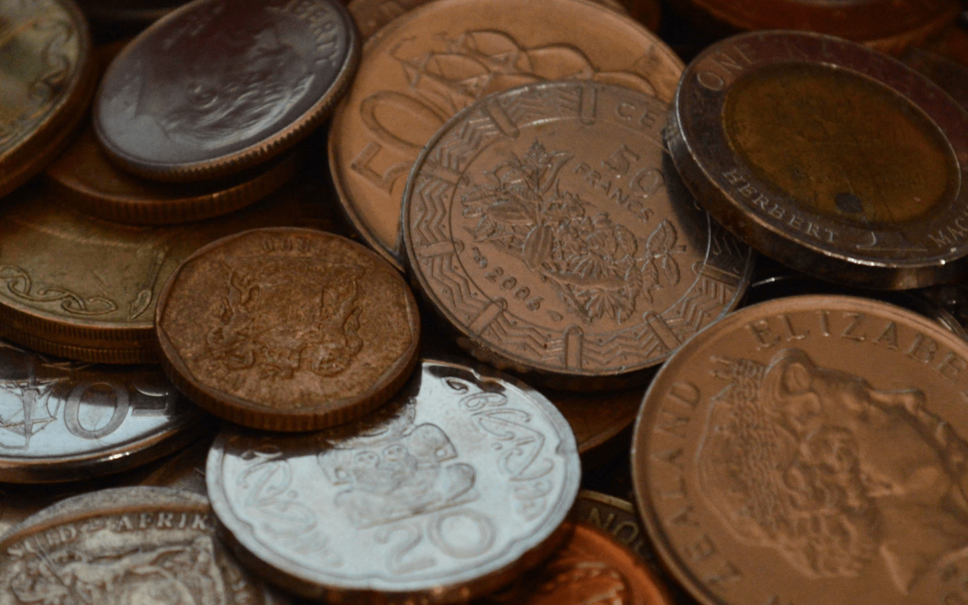 Coins symbolizing funding and financial planning in e-commerce fulfillment for crowdfunding campaigns.