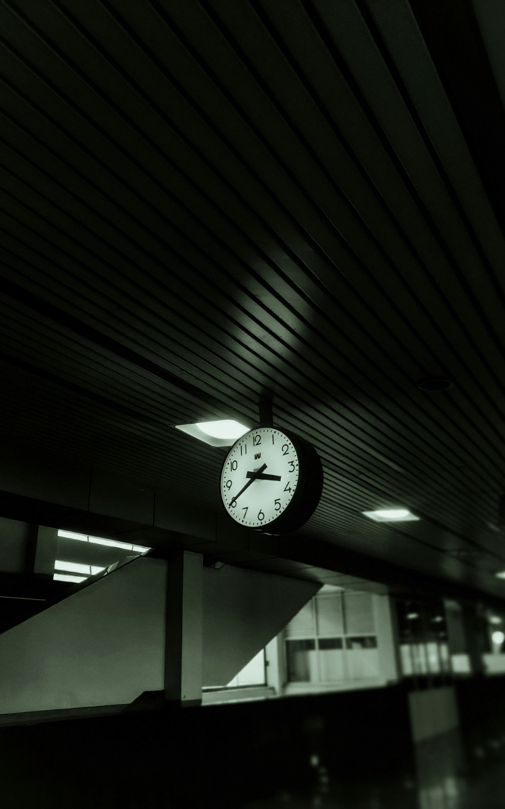 Clock hanging in a modern building, symbolizing the time saved by ecommerce brands when outsourcing fulfillment to focus on growth and product development.