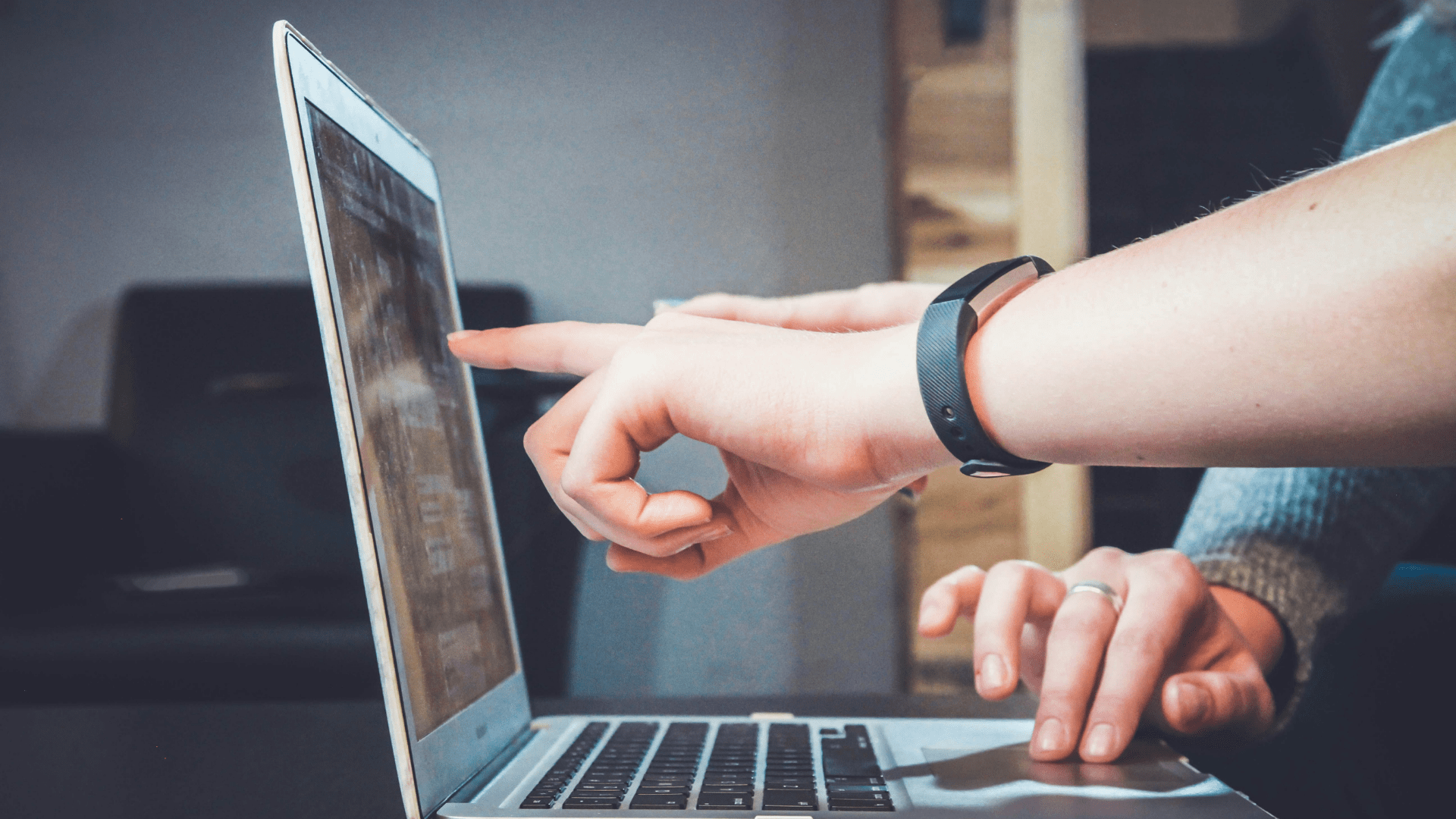 Team reviewing digital inventory data on a laptop, illustrating how digitized stock movements improve accuracy, control, and profitability in modern e-commerce fulfillment.