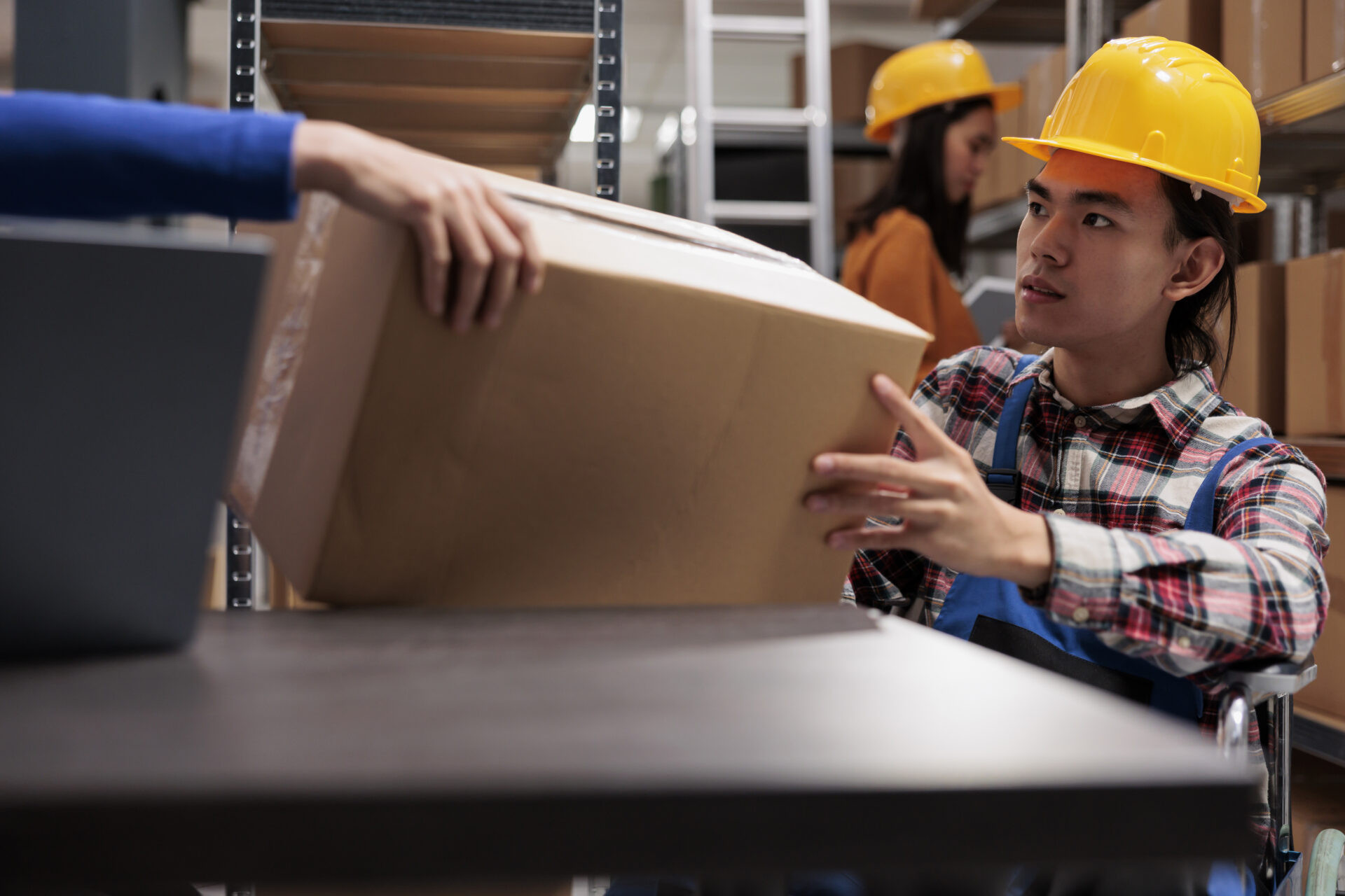 E-commerce team packing orders in an in-house fulfillment setup.