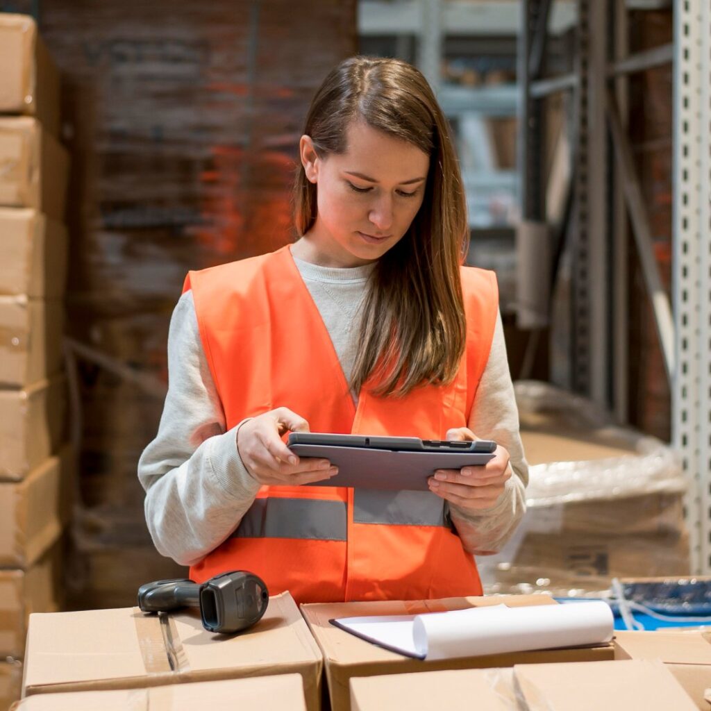 E-commerce warehouse packing station with prepared customer orders