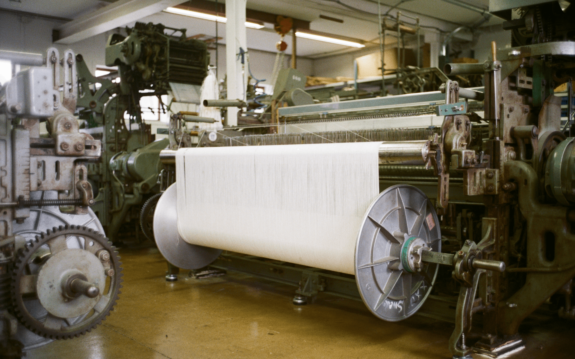 Textile production process illustrating material origin for apparel labeling in Europe.