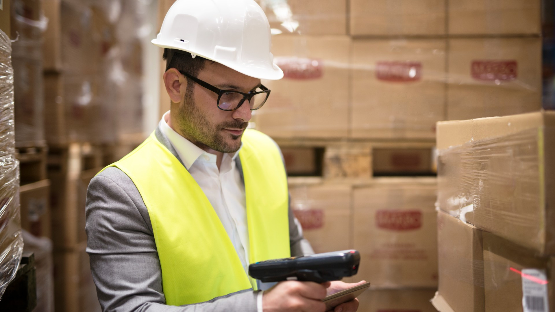 Warehouse worker scanning barcodes for e-commerce inventory and order fulfillment