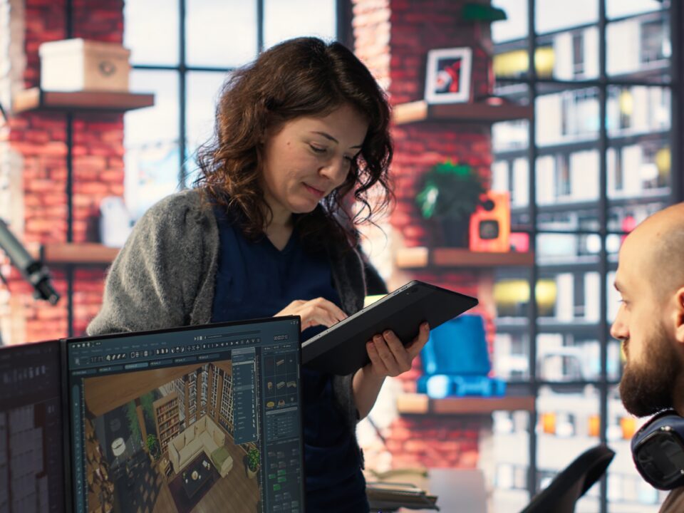 E-commerce manager using AI-driven demand sensing software to forecast inventory needs