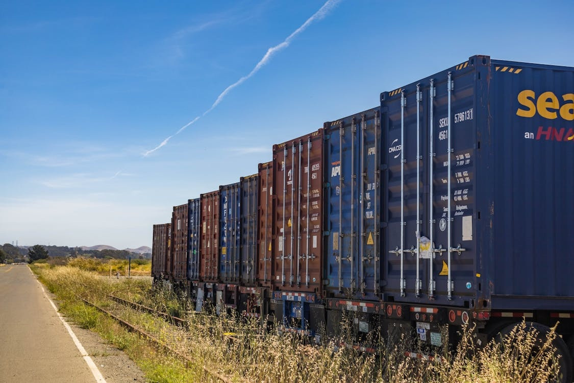 metal colorful containers and boxes stacked close to each other