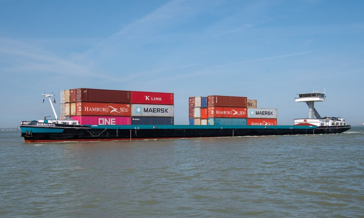 Large cargo ship sailing with logistics goods