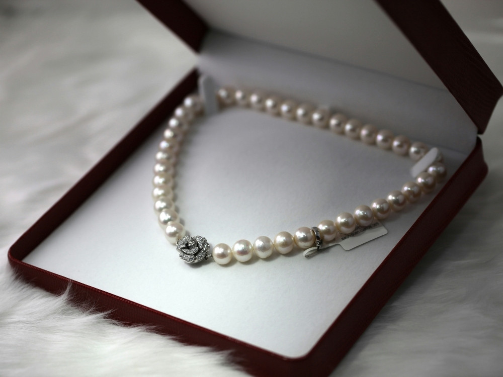 High-value pearl necklace prepared for secure luxury fulfillment.